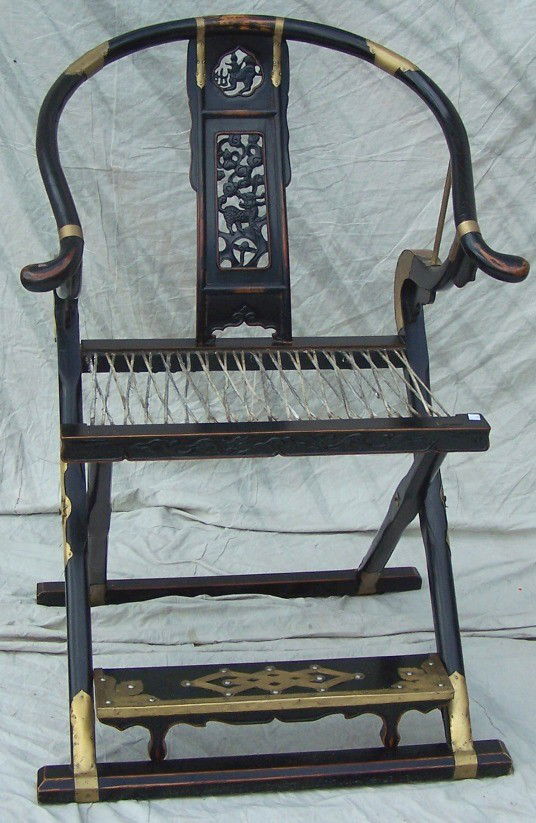 ***CHINESE THRONE CHAIR: Having ebony ground and brass clad decoration, approximate height 41'', width 28 1/4'', depth 27''.