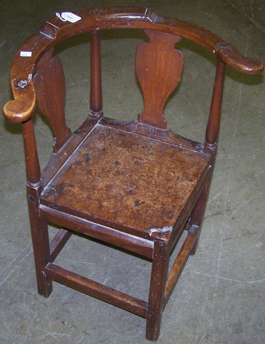 ***19TH C. GEORGIAN STYLE CORNER CHAIR: Having vase shaped splats and square legs joined with square stretchers, approximate height 28 1/4'', width 23'', depth 20''.