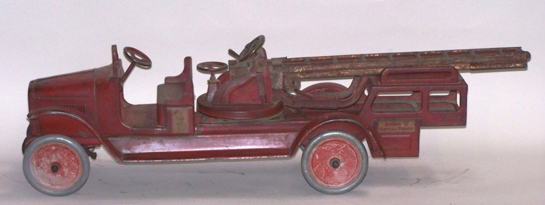 ***BUDDY L AERIAL LADDER TRUCK: Having open cab, steel disc wheels and tires, operational steering, approximate length 33''.