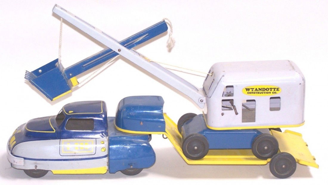 ***WYANDOTTE WINCH TRUCK & STEAM SHOVEL: Pressed steel, marked ''Wyandotte Construction Co.'', having operating removable shovel, truck cab marked ''C-200'', and trailer attached with swivel and folding loading ramp, approximate length 23''.