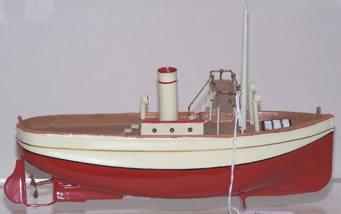 ***TIN WIND UP TOY SHIP: Possibly made by Carette, having single funnel and propeller, hand soldered upper deck railing, approximate length 10 1/2''.