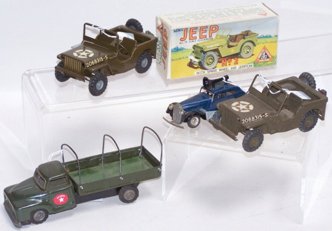 ***4 TIN WIND UP VEHICLES: Including 2 Minic Triang Toys Clockwork Army Jeeps, one in original box, one wind up car by Minic Toys and one tin friction Army truck.
