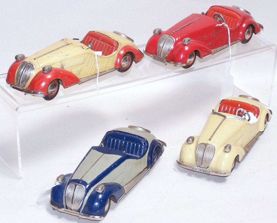 ***4 DISTLER WIND UP BMW CARS: 1 Red, 1 blue and gray, 1 beige and 1 beige and red.