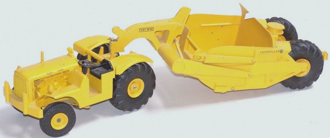 ***REUHL DIE CAST CATERPILLAR SCRAPER: Ruehl DW-10 tractor with No. 10 scraper, approximately 1/24 scale, length 19'', includes die cast hitch for No. 70 scraper.