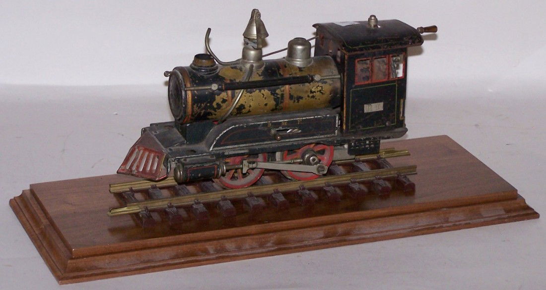 ***VINTAGE MARKLIN O GAUGE LIVE STEAM LOCOMOTIVE: Marked ''R.I.'' on side of cab, with Marklin logo on front on boiler, in wood and Lexan display case.