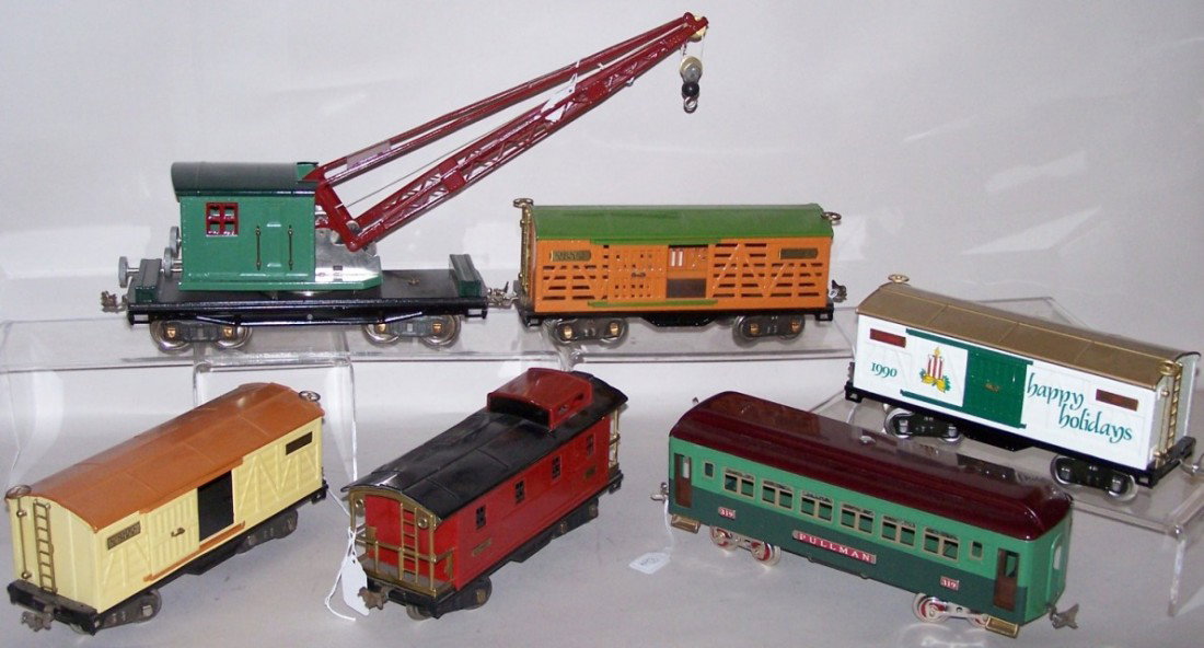 ***6 LIONEL STANDARD GAUGE TRAINS: #517 Caboose, #319 Pullman coach, #514 box car (TCA restored tin plate), #513 stock car (altered tin plate), #219 crane car and #13602 1990 Holiday box car (with original box).