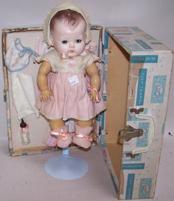 ***AMERICAN CHARACTER DOLL: Tiny Tears, having sleep eyes, molded hair, marked on back ''AME, Character,'' comes with dressing box and accessories.
