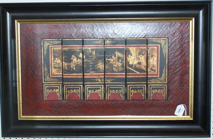 ***CHINESE BLACK LACQUER TABLE SCREEN: Having figural and landscape decoration in colors of black and red with gilt highlight, contained in shadow box frame, approximate screen size 9 3/4'' x 20'', frame size 21 1/4'' x 33''.