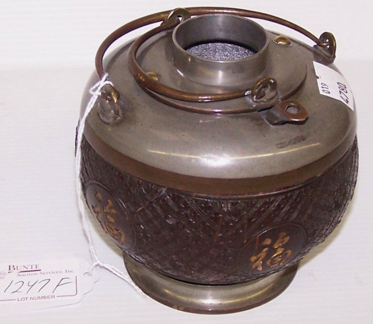 CHINESE COCONUT AND METAL WATER JUG: Fitted with bale handle, approximate height 4 1/4''.