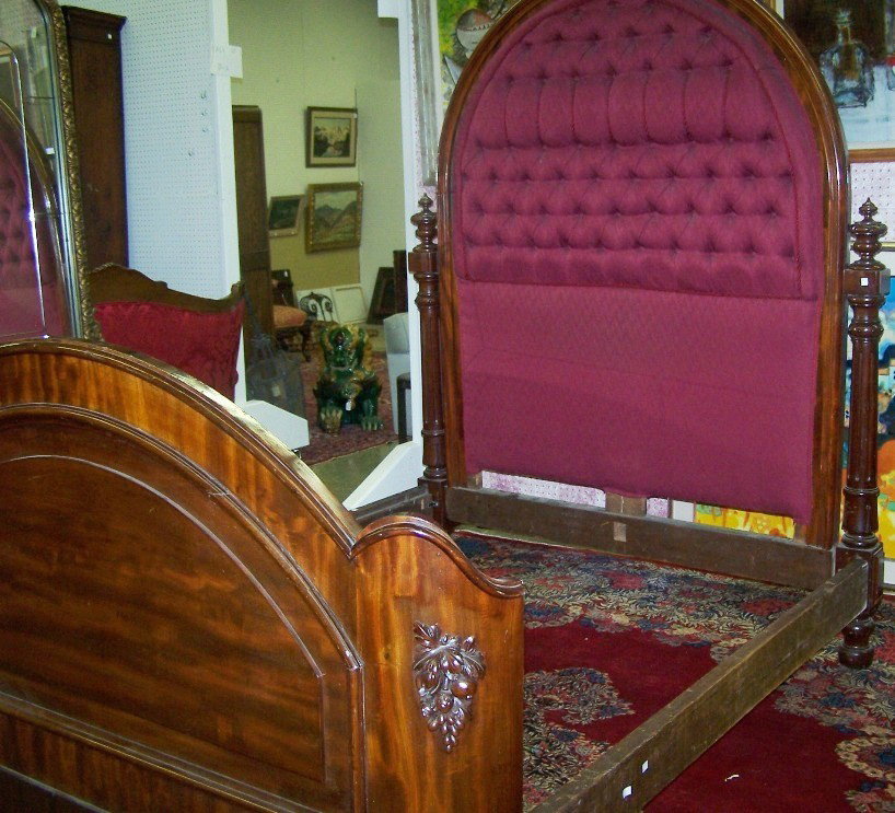 VICTORIAN MAHOGANY BEDSTEAD: Having domical headboard with tufted purple upholstery, approximate height 77'', width 61 1/2'', depth 82''.