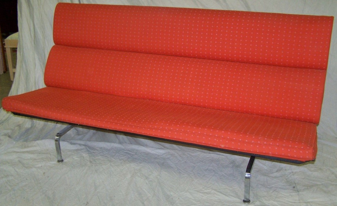 ***CHARLES AND RAY EAMES FOR HERMAN MILLER SOFA: Having orange upholstery and fold down back with steel frame, approximate height 35'', width 30'', depth 28''.