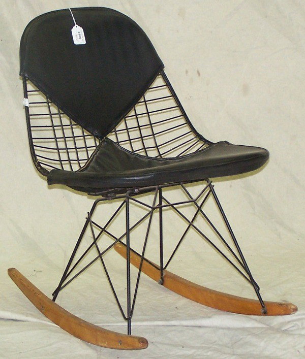 ***HERMAN MILLER ROCKER: Having black iron frame with black upholstered back and seat, raised on wood rockers.