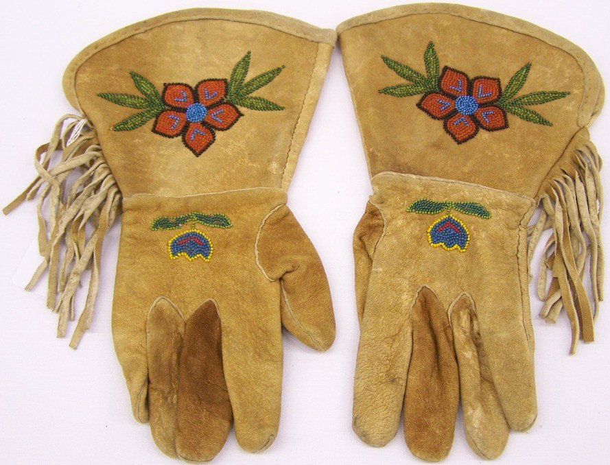 ***BEADED GAUNTLET GLOVE: Beaded with flower and leaf design in colors of yellow, blue, red, orange and green, approximate size 14'' x 8 1/4''.