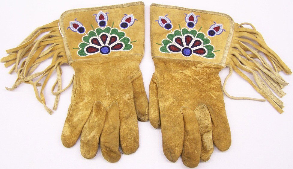***BEADED GAUNTLET GLOVE: Beaded with stylized flower design in colors of white, black, red, green and blue, approximate size 13 1/4'' x 6 3/4''.