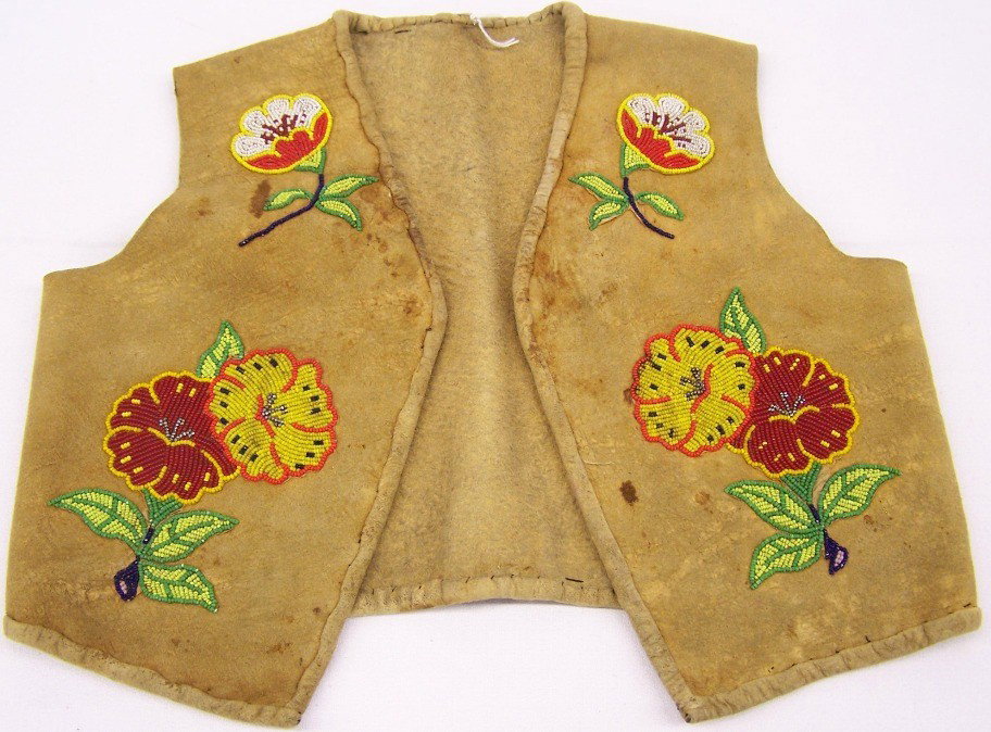 ***CHILD'S HIDE VEST: Beaded with flower and leaf design in colors of white, red, green, black, yellow and silver.
