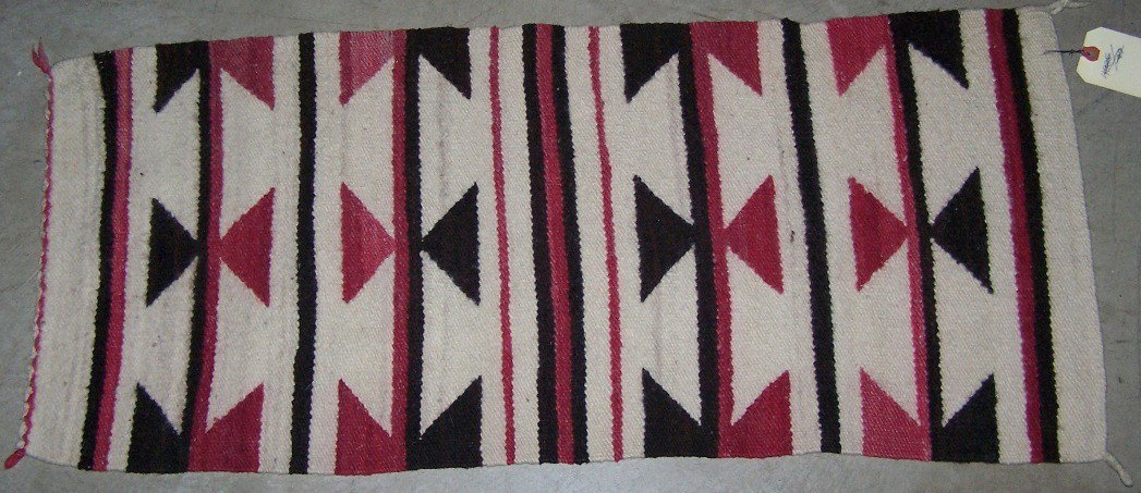 ***NAVAJO WEAVING: Having triangular inline design in colors of black, red and white, approximate size 36'' x 16 1/2''.