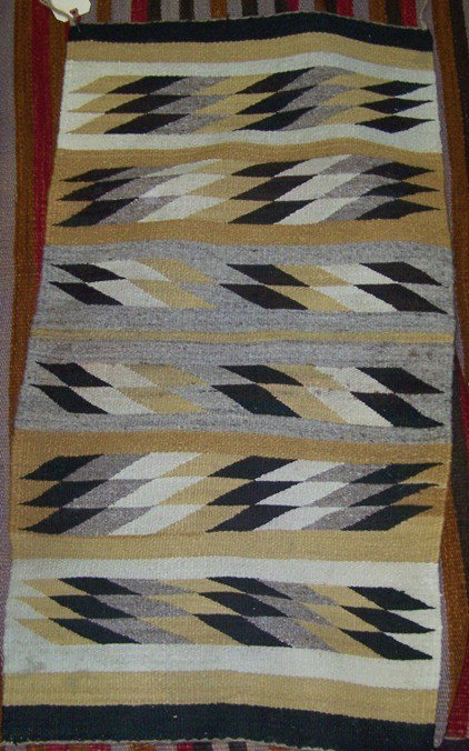 ***NAVAJO WEAVING: With band design in colors of gold, black, gray and white, approximate size 42 1/2'' x 23''.