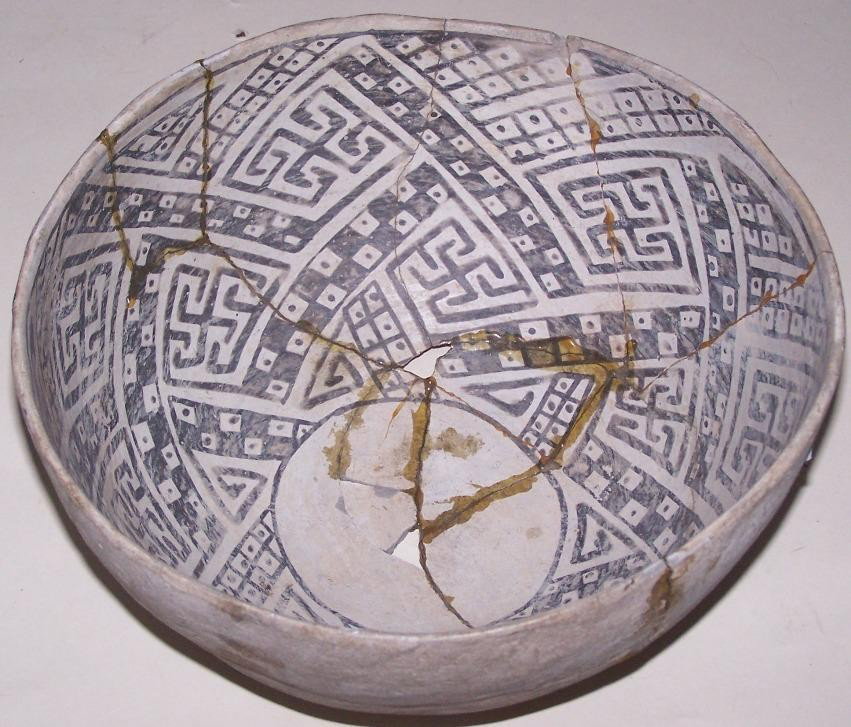 ***POTTERY BOWL: With interior black and white line and box design, approximate diameter 11 3/4'', height 6''.