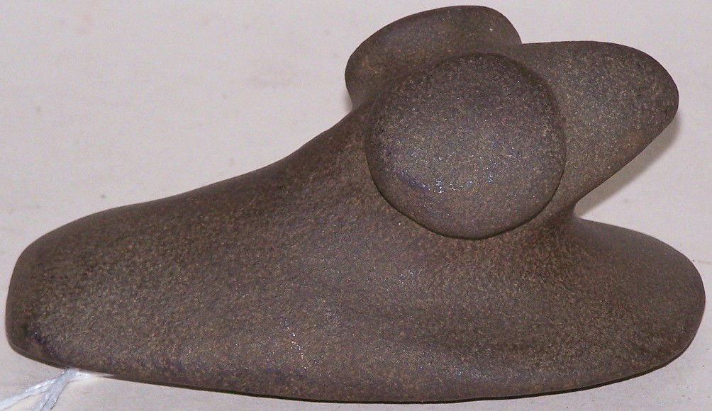 ***POPEYE BIRDSTONE: Brown-green hardstone, marked on bottom ''Warren Co. Ind/Wabash River'', approximate size 4 1/2'' x 2 1/8'' x 2 1/8''.