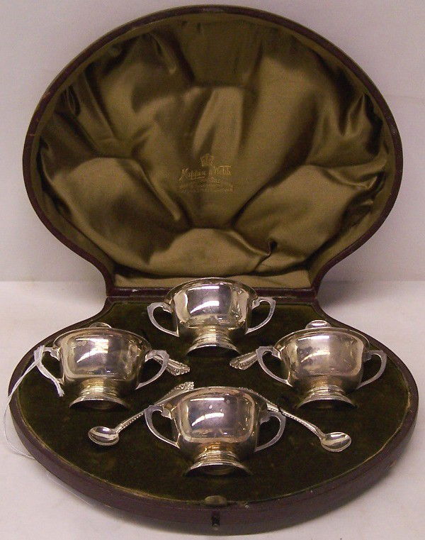 ENGLISH STERLING SILVER SALT SET| Comprising 4 tw: ENGLISH STERLING SILVER SALT SET| Comprising 4 two-handled salts and spoons, maker's mark "VB & S", complete with fitted case, signed "Mappin & Webb", approximate weight 6 troy ounces.