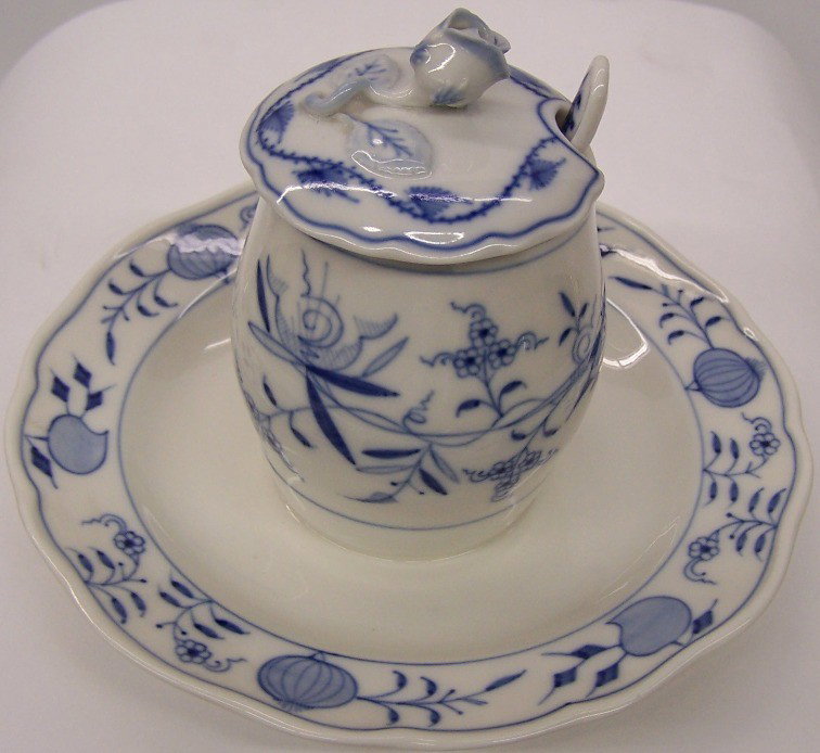 ***MEISSEN PORCELAIN BLUE ONION MUSTARD POT: With attached underdish, complete with spoon, having Meissen blue crossed swords mark on base.