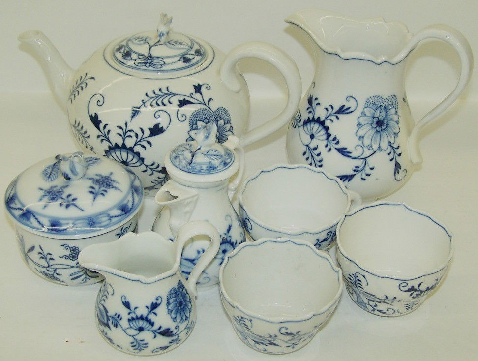 ***GROUP OF MEISSEN PORCELAIN BLUE ONION: Comprising pitcher, teapot, covered creamer, covered sugar, open creamer and 3 tea cups, all signed ''Meissen''.
