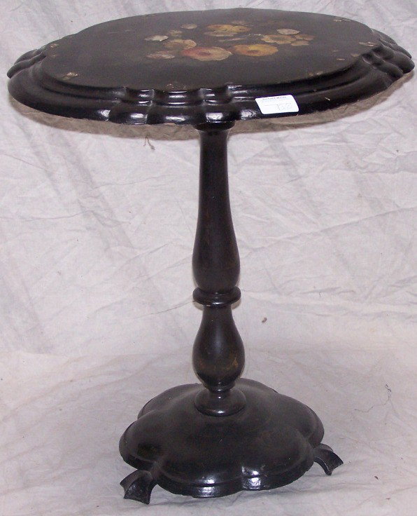 VICTORIAN PAPIER MACHE TABLE: The oval tilt top having painted floral decoration, raised on pedestal base, approximate height 28'', width 25'', depth 21''.