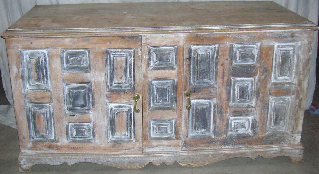 ***19TH C. COUNTRY FRENCH STYLE DRESSER: Formerly owned by architect Joseph Cerney, having antiqued finish and fitted with 2 paneled doors, approximate height 34 3/4'', width 66 1/2'', depth 30''.