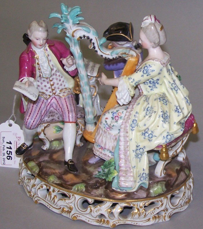 ***MEISSEN PORCELAIN FIGURAL GROUP: Depicting musicians in 17th century dress, having Meissen blue crossed swords mark on base, approximate height 7 1/2''.