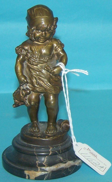 ***JUAN CLARA| (Spanish 1875-1957) Bronze sculpt: ***JUAN CLARA| (Spanish 1875-1957) Bronze sculpture depicting young girl holding doll, raised on circular marble base, signed "Juan Clara, Made in France", approximate bronze height 5 3/4", overall he
