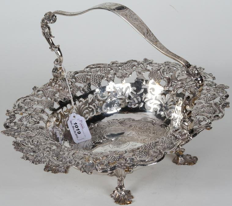 ***GEORGE II STERLING SILVER BASKET: Maker's mark ''RS for Robert Brown'', city mark ''London'', date mark ''1742'', having mask and grapevine decoration, approximate height 4 1/4'', handle height 10 1/2'', width 15 1/2'', depth 11 1/2''