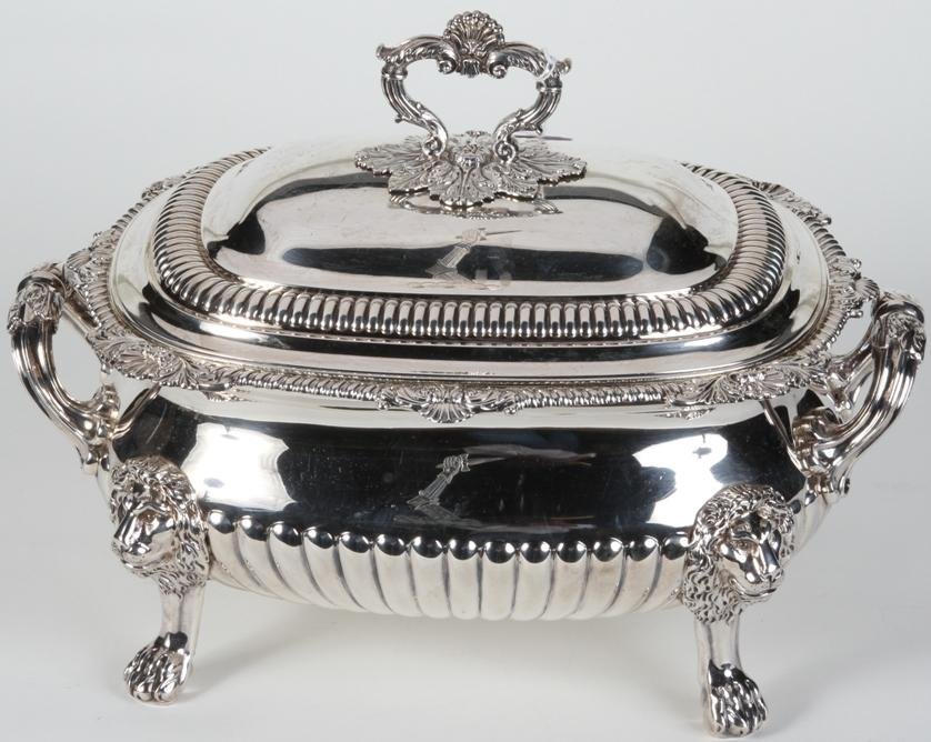 ***ENGLISH STERLING SILVER TUREEN: Maker's mark ''For William Charles and Henry Eley'', city mark ''London'', date mark ''1823-24'', having leaf decoration and raised on lion head and paw feet, approximate height with handle 10 1/2'', 