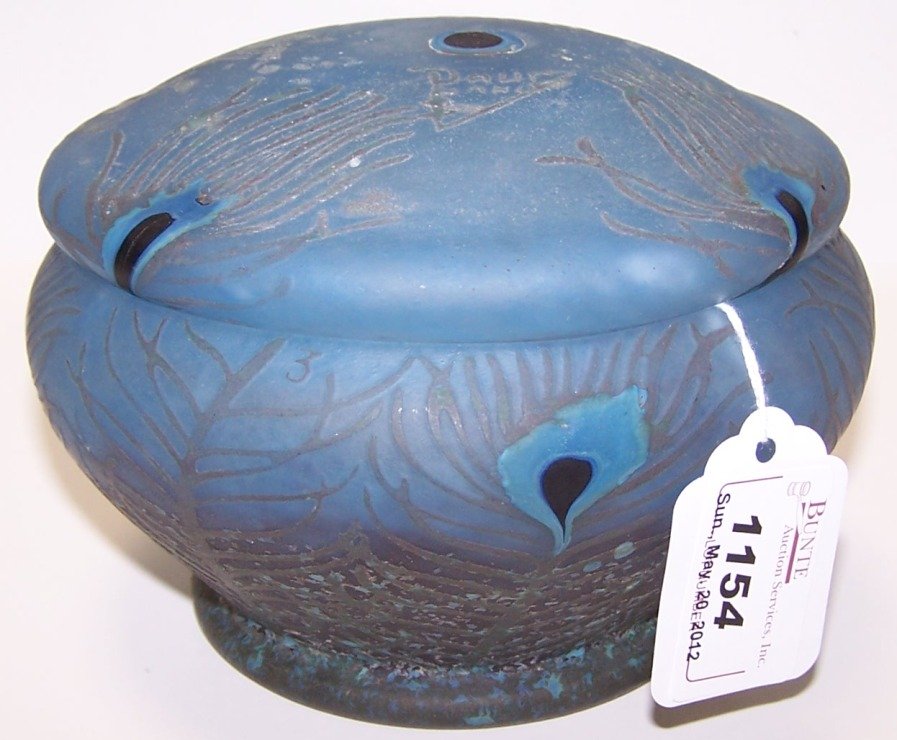 ***DAUM NANCY CAMEO GLASS PEACOCK COVERED BOX: Cut brown to blue, with peacock feather decoration, signed ''Daum Nancy'', approximate height 4 1/4'', diameter 6''.