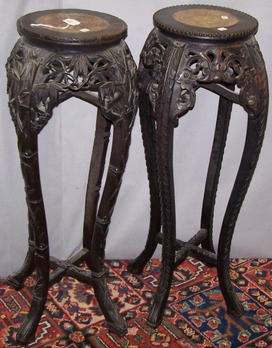 ***TWO CHINESE CARVED URN STANDS: Circular top having inset marble, approximate height 35 1/2'', diameter 14''.
