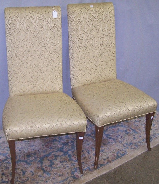 SET OF FOUR ROBSJOHN GIBBINGS HIGHBACK ARMCHAIRS: Having gold upholstery, approximate height 40'', width 20 1/4'', depth 24''.