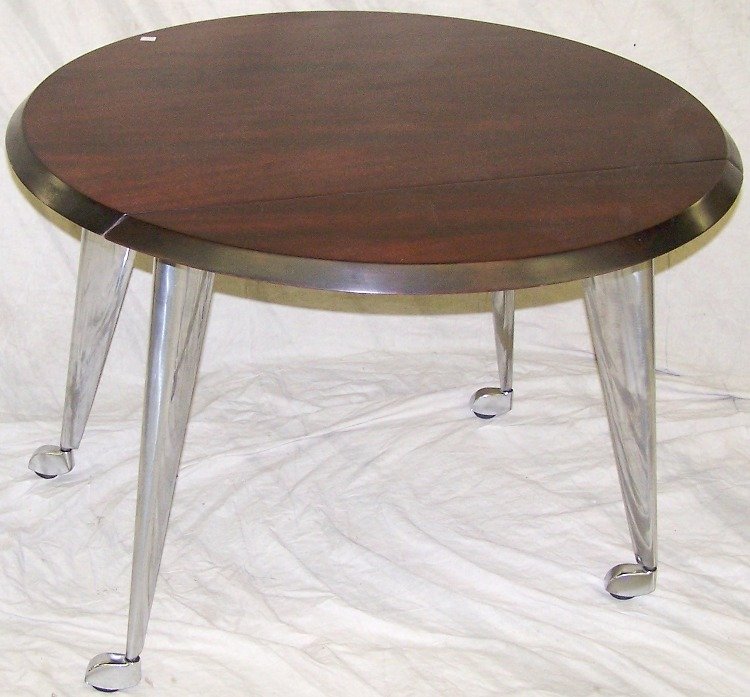 PHILIPPE STARCK AND ALEF DRIAD ROLLING TABLE: Having single drop leaf, approximate height 28 1/2'', width 37 3/4'', depth 30'' closed, 38'' open.