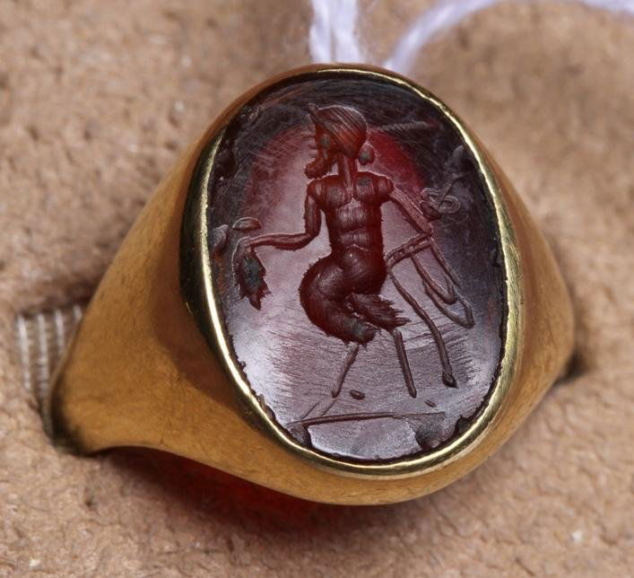 ***14K YELLOW GOLD RING: Set with 1 carved carnelian stone, having figural decoration, approximate ring weight 6.1 dwt.