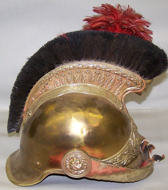 ***FRENCH STYLE GENDARMERIE HELMET: Having comb with black horsehair and plume holder with plume on left side, complete with scaled, mounted leather chin strap with lion's head rosettes.
