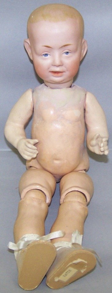 BISQUE HEAD CHARACTER BOY DOLL: Having painted blue intaglio eyes, open mouth, composition body with ball-jointed legs, marked ''Made in Germany 406 13/0 DRGM'', approximate height 13''.