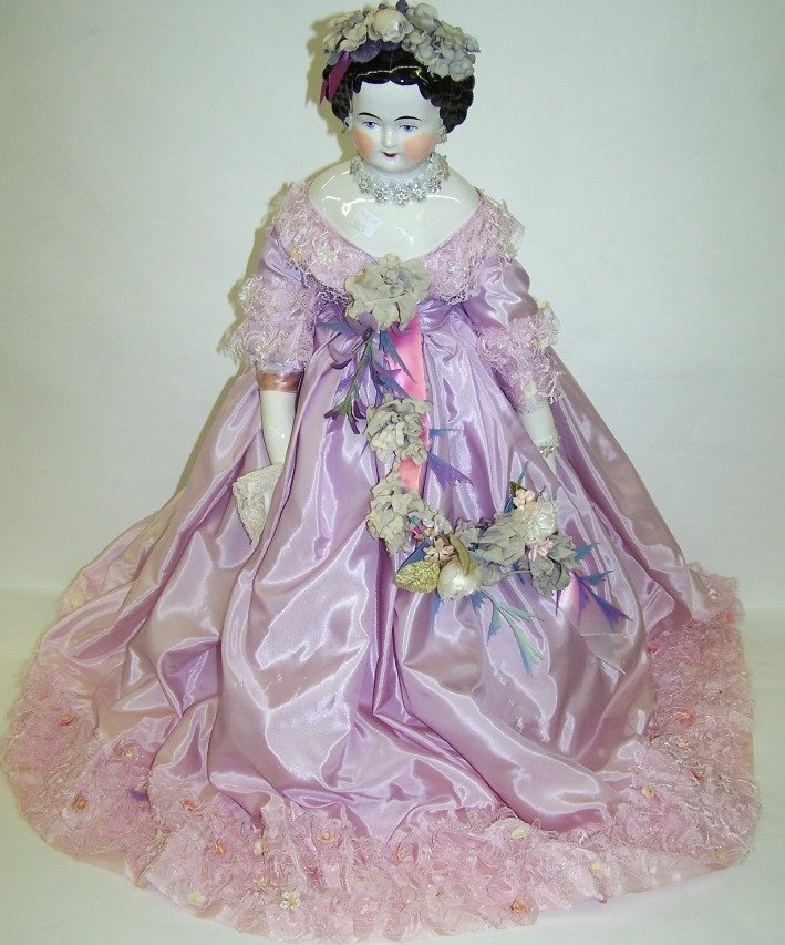 ***20TH C. CHINA HEAD DOLL: | Black hair, with painted features, approximate height 24", purchased at Dunning's Auction June 9, 1979, where it was consigned by the daughter of Mrs. Otto Kerner.