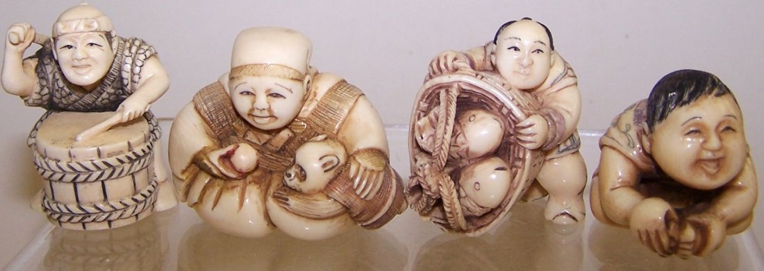 FOUR JAPANESE CARVED IVORY NETSUKES: Figural form. Note: Items containing ivory will only be shipped domestically and cannot be shipped to California.