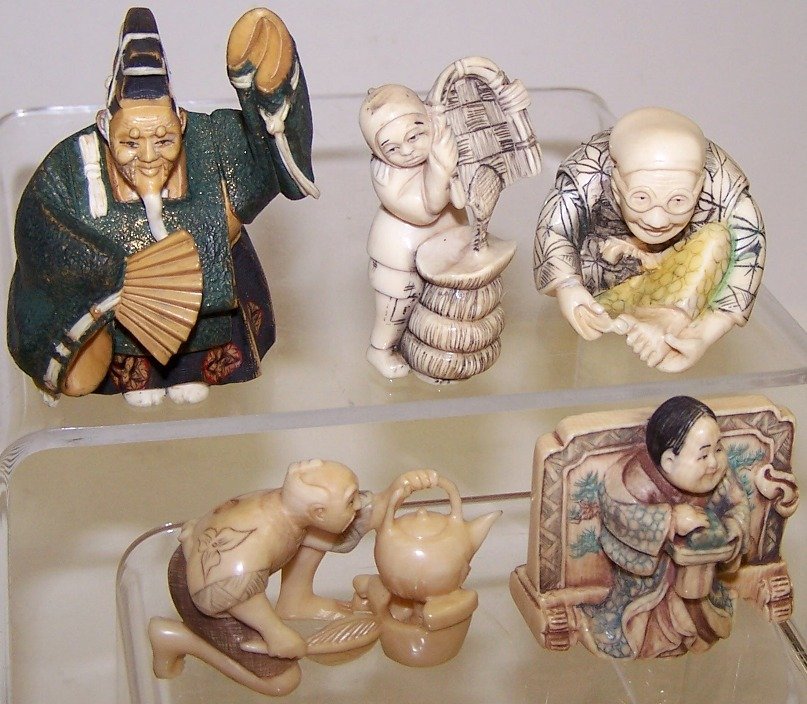 FIVE JAPANESE CARVED IVORY NETSUKES: Figural form. Note: Items containing ivory will only be shipped domestically and cannot be shipped to California.