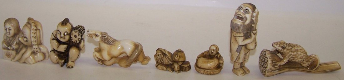SEVEN JAPANESE CARVED IVORY NETSUKES: 5 Human form, 1 frog form and 1 horse form. Note: Items containing ivory will only be shipped domestically and cannot be shipped to California.