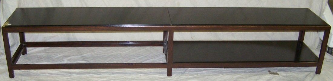 ***DUNBAR COFFEE TABLE BY EDWARD WORMLEY: Having rosewood frame, the rectangular top raised on square legs, joined with platform stretcher, underside bearing brass Dunbar label and paper label, approximate height 15 1/4'', width 85 1/2'', dep