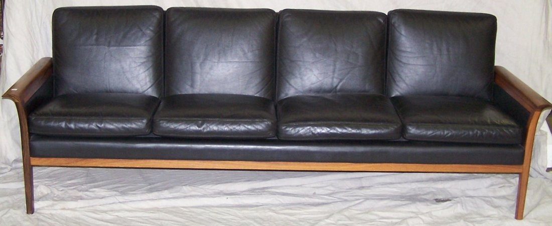 ***MID-CENTURY MODERN SCANDINAVIAN SOFA: Having black leather upholstery and teak frame, approximate height 31'', width 68'', depth 31''.