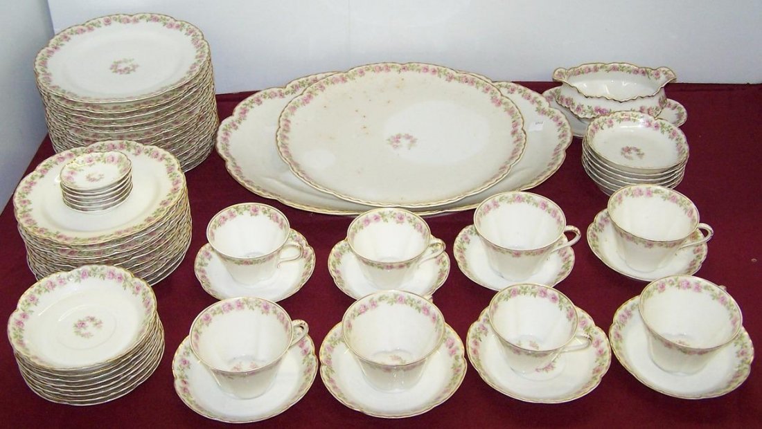 ***SET OF HAVILAND DINNERWARE: With floral border, 13 salad plates, approximate diameter 8 3/4'', 10 dessert plates, diameter 7 1/2'', 6 fruit bowls, diameter 5'', 8 cups, 16 saucers, sauce boat with underdish, circular platter, ov