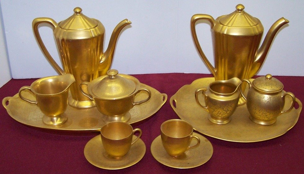 ***12 PIECES OF PICKARD DECORATED PORCELAIN: Bavarian cups and saucers and two 4 piece coffee services.