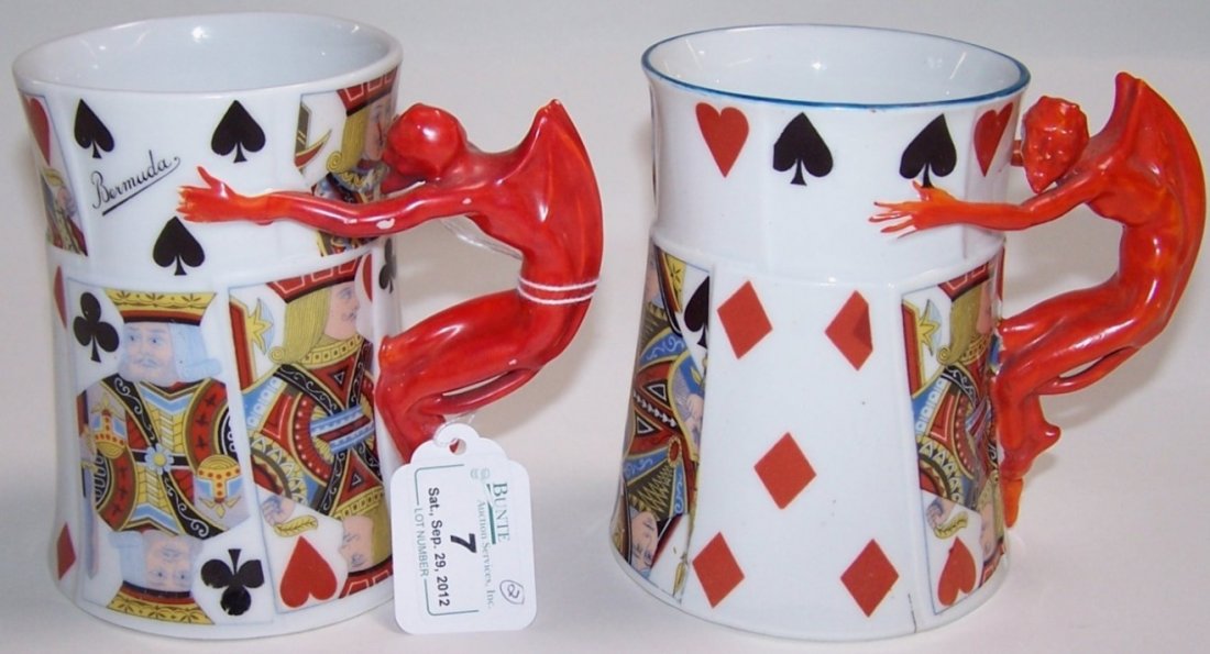 TWO ROYAL BAYREUTH TANKARDS: ''Devil and Playing Cards'' pattern, approximate height 4 7/8'' and 4 3/4''.
