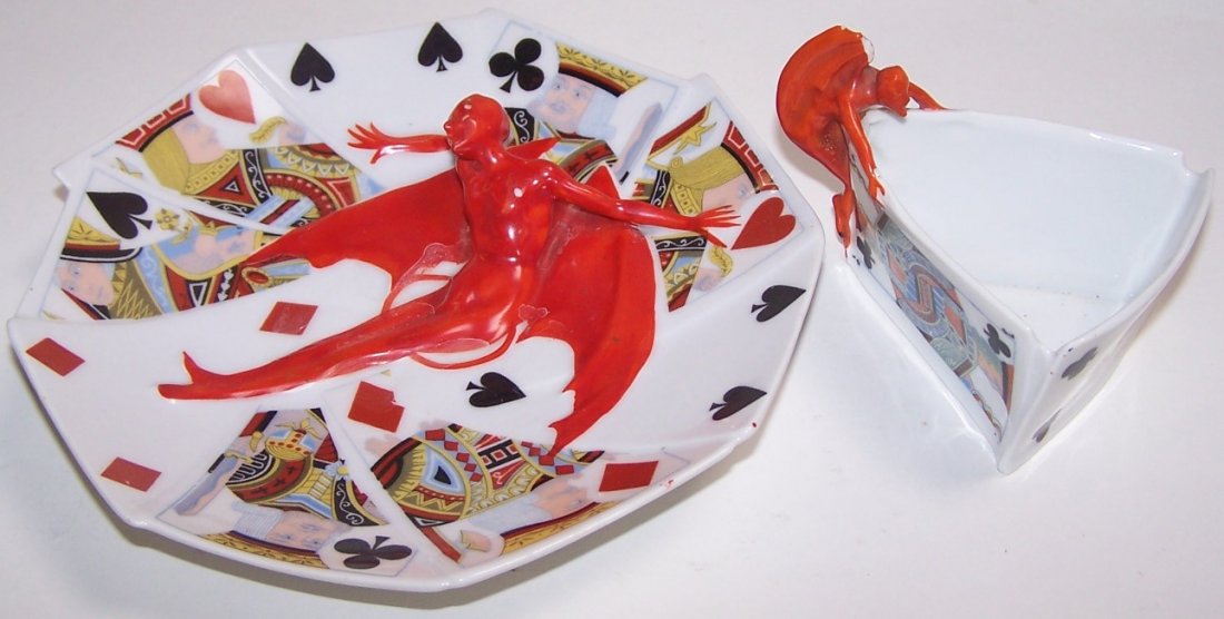 TWO PIECES OF ROYAL BAYREUTH: ''Devil and Playing Cards'' pattern, plate, approximate widest diameter 6 7/8'', and master salt, height 2 5/8''.