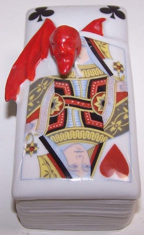 ROYAL BAYREUTH COVERED STAMP BOX: ''Devil and Playing Cards'' pattern, approximate length 3 7/8''.